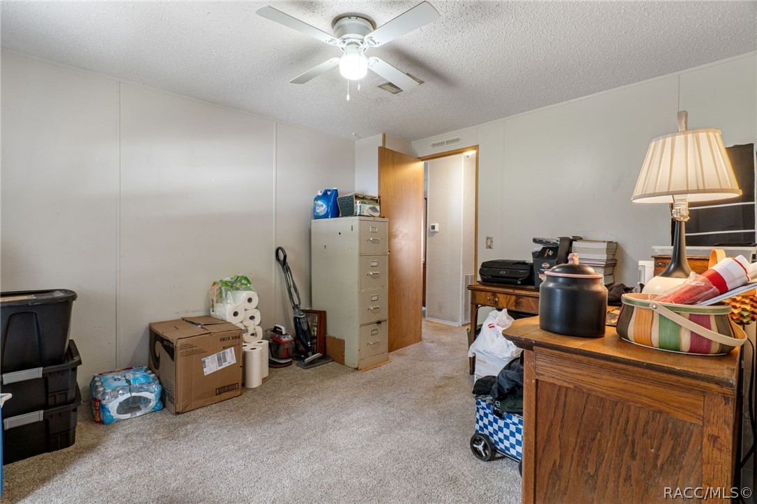 7927 West Cyprian Court Homosassa, FL 34448 - Photo 26 of 40 a room with gym equipment and a window