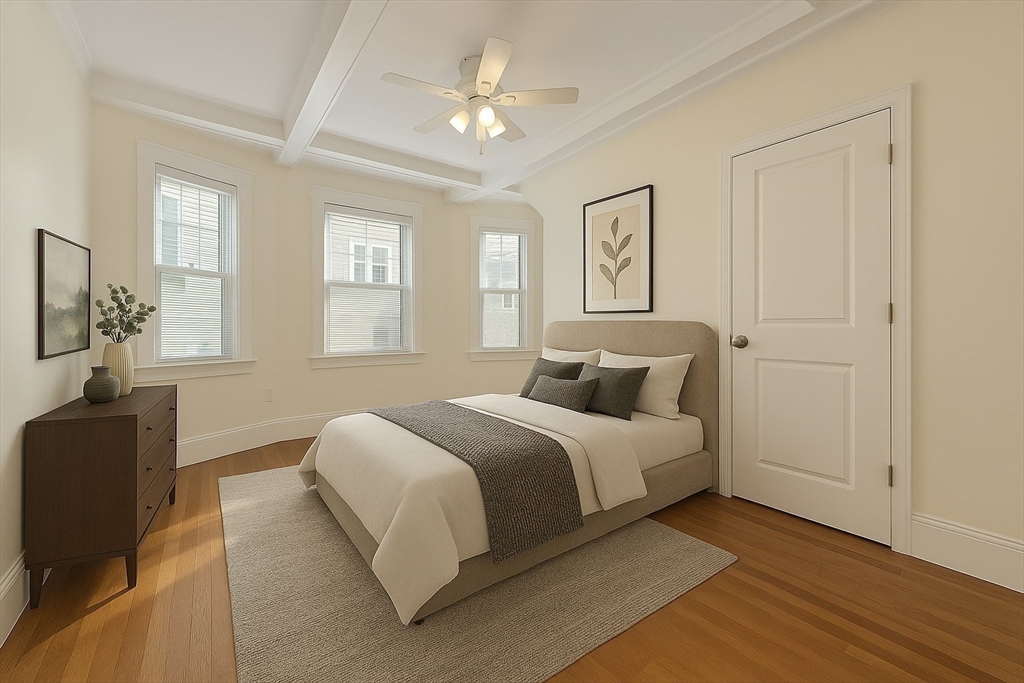48 Manthorne Road, Unit 1 Boston, MA 02132 - Photo 6 of 17 a spacious bedroom with a bed and wooden floor