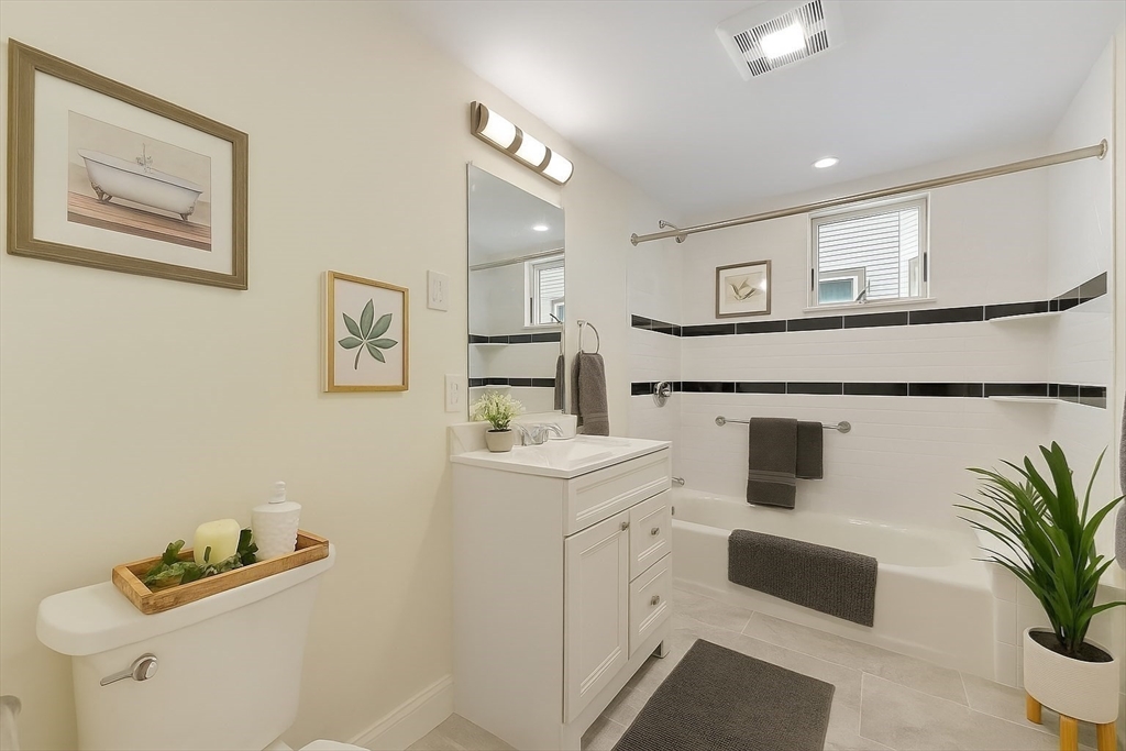 48 Manthorne Road, Unit 1 Boston, MA 02132 - Photo 9 of 17 a living room with furniture and a potted plant