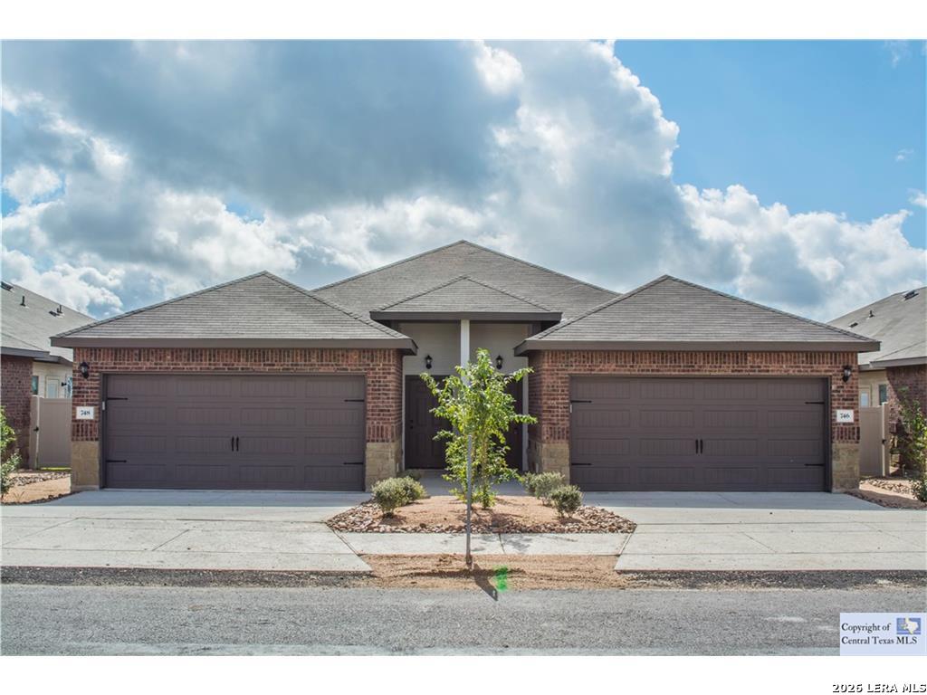 746-748 Saengerhalle Road New Braunfels, TX 78130 - Photo 1 of 14 a view of a house with a garden and garage
