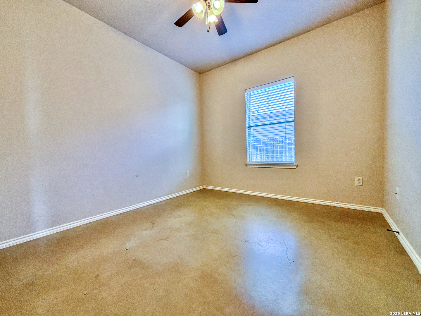 746-748 Saengerhalle Road New Braunfels, TX 78130 - Photo 11 of 14 an empty room with a window and a chandelier fan