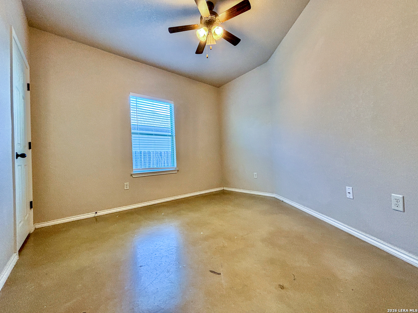 746-748 Saengerhalle Road New Braunfels, TX 78130 - Photo 12 of 14 an empty room with a ceiling fan and a window