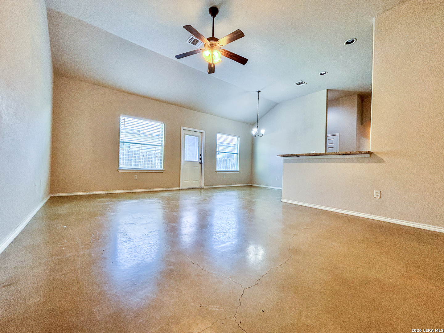 746-748 Saengerhalle Road New Braunfels, TX 78130 - Photo 4 of 14 a view of an empty room with window and wooden floor