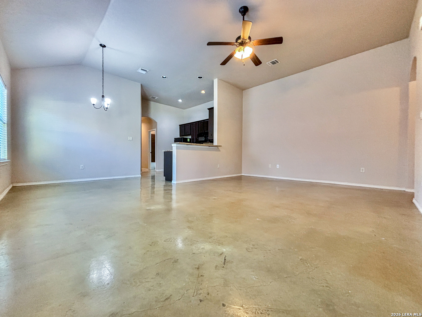 746-748 Saengerhalle Road New Braunfels, TX 78130 - Photo 5 of 14 a view of a kitchen with a ceiling fan and a ceiling fan
