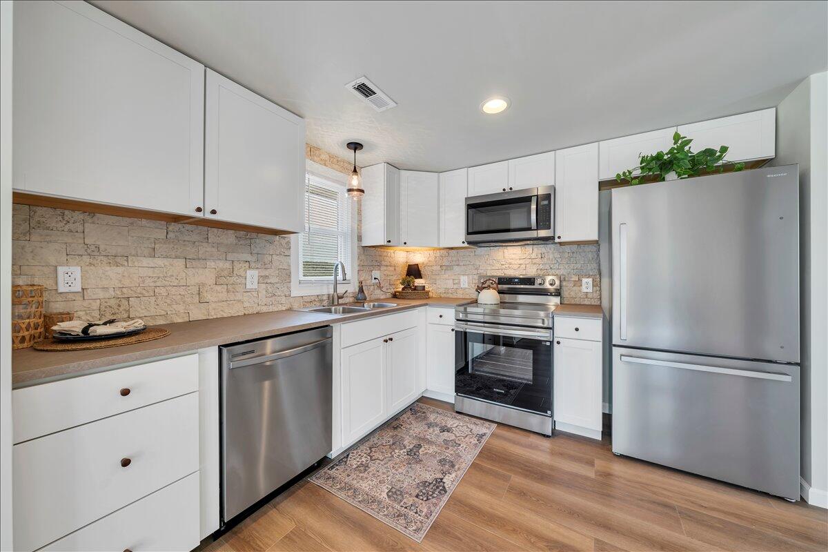 7153 Peppers Ferry Road Max Meadows, VA 24360 - Photo 12 of 67 a kitchen with a refrigerator stove and sink