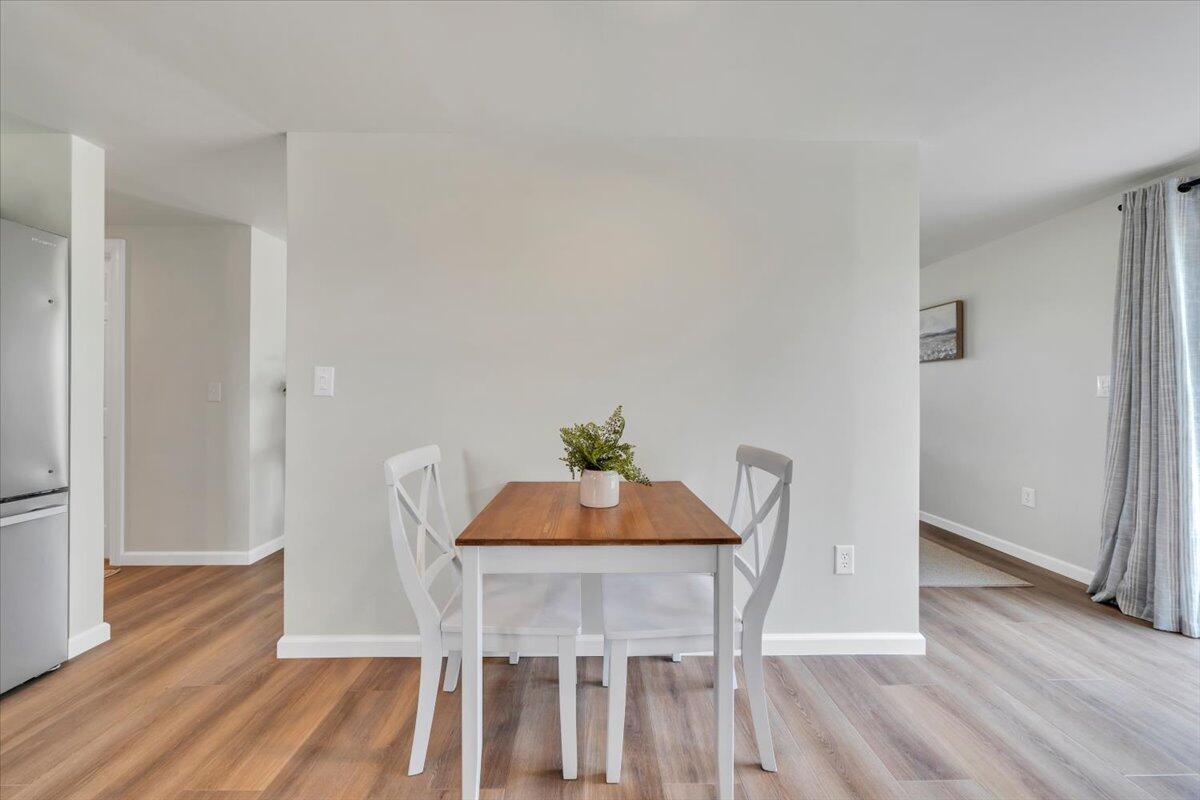 7153 Peppers Ferry Road Max Meadows, VA 24360 - Photo 17 of 67 a view of a dining room with furniture and wooden floor