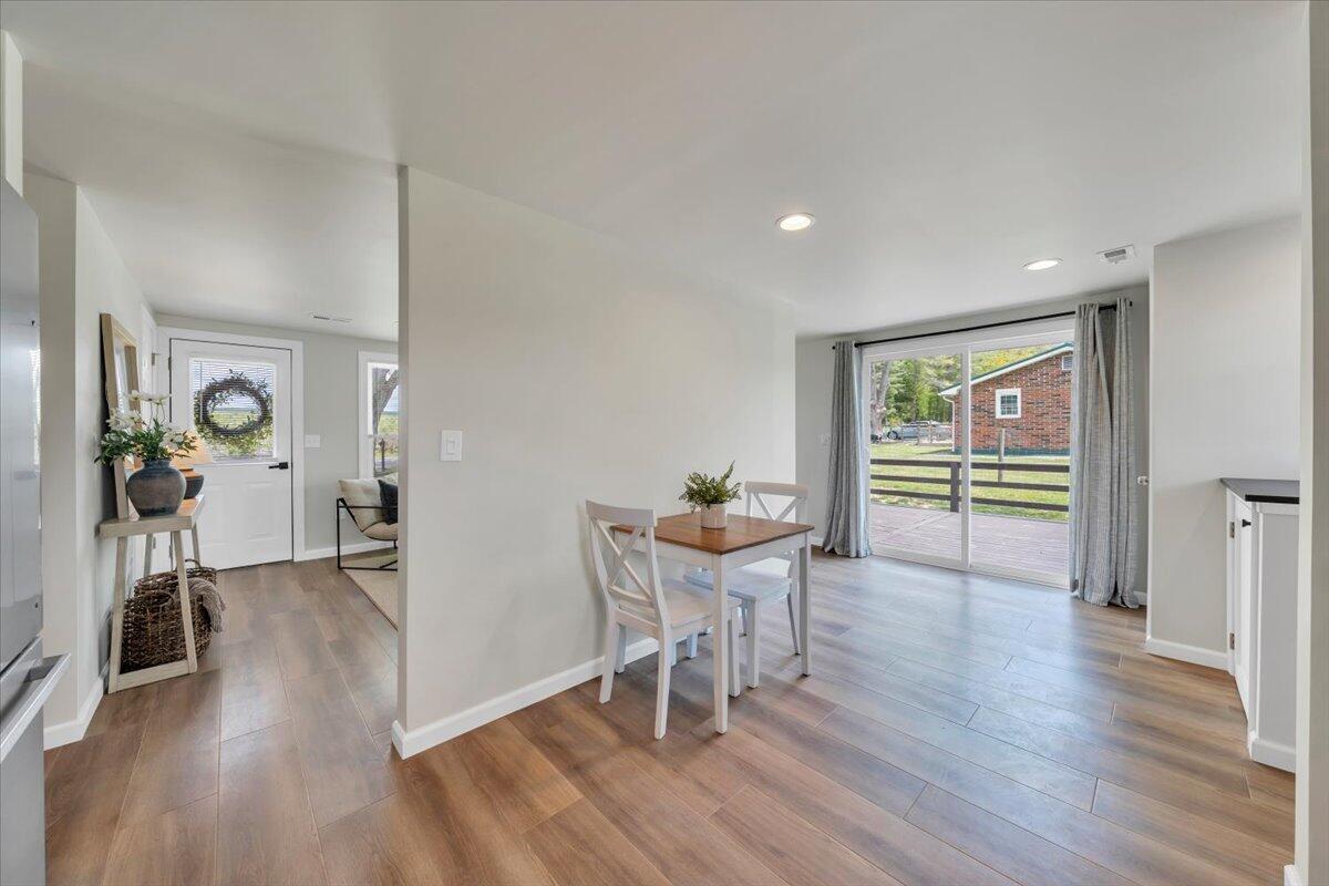 7153 Peppers Ferry Road Max Meadows, VA 24360 - Photo 18 of 67 a view of a dining room with furniture and wooden floor