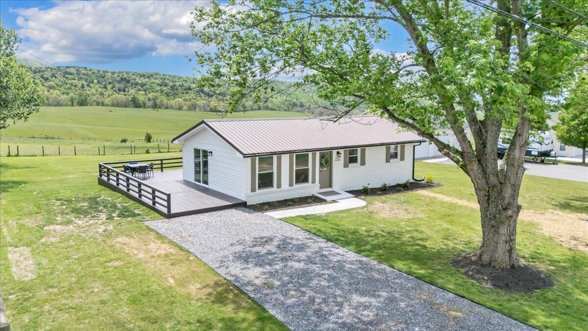 7153 Peppers Ferry Road Max Meadows, VA 24360 - Photo 2 of 67 a view of a house with a yard and sitting area