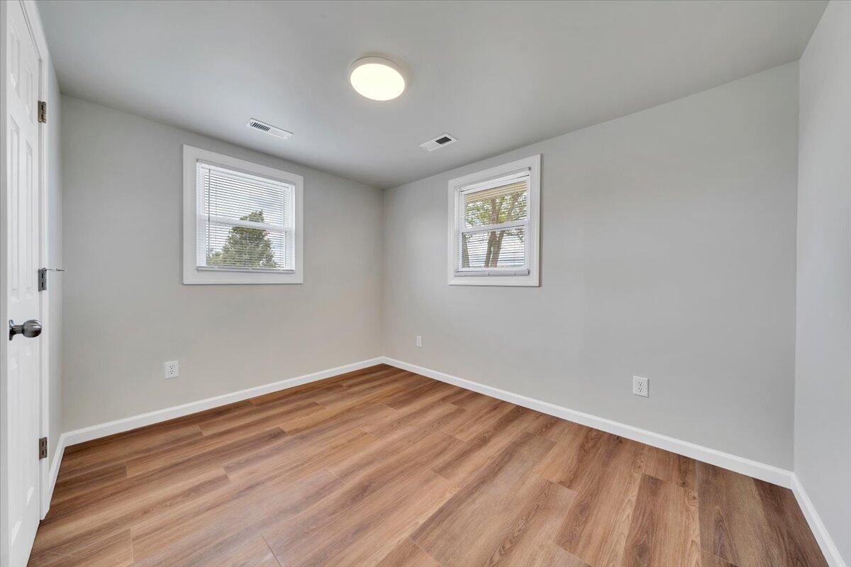 7153 Peppers Ferry Road Max Meadows, VA 24360 - Photo 25 of 67 a view of empty room with wooden floor and fan