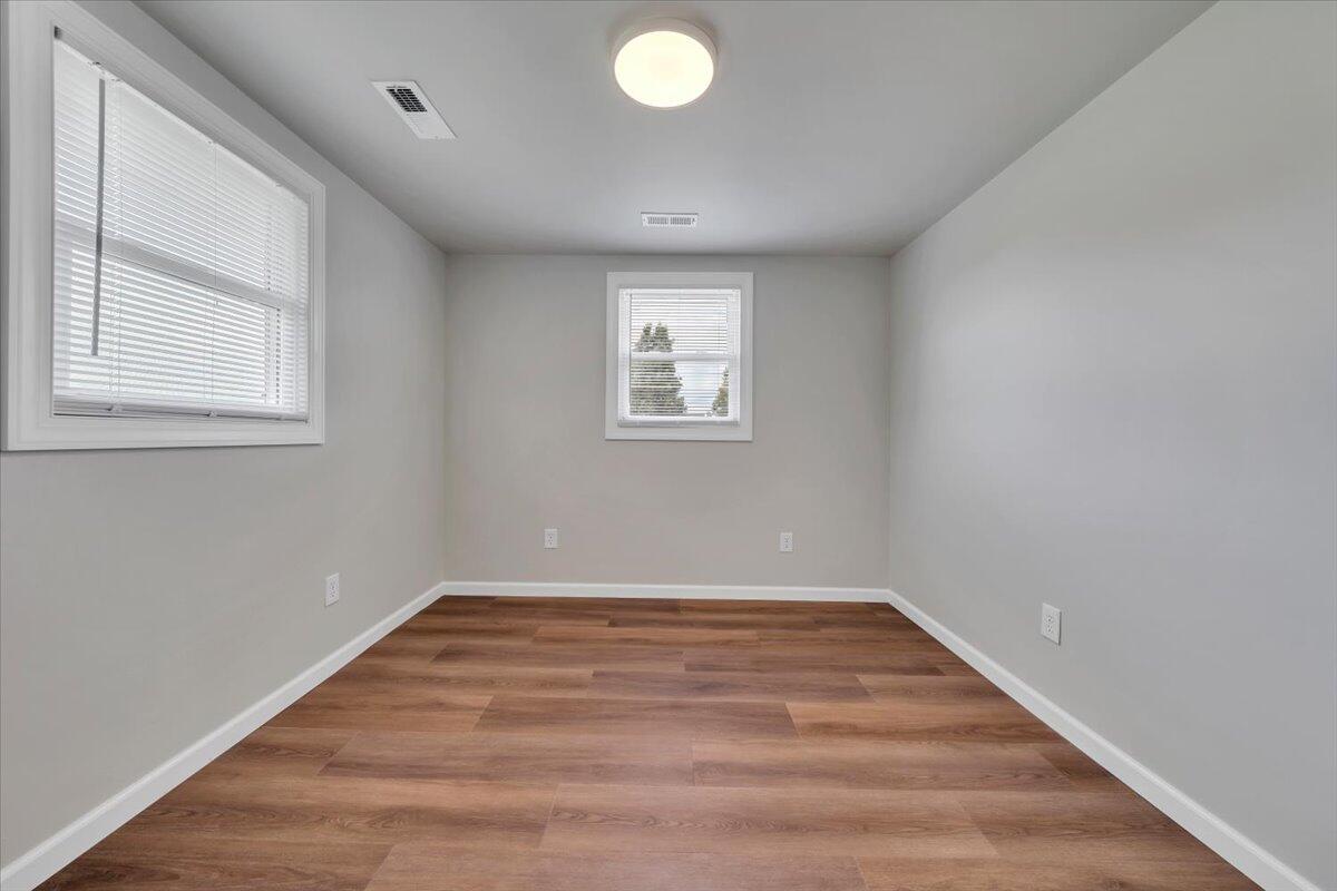 7153 Peppers Ferry Road Max Meadows, VA 24360 - Photo 27 of 67 wooden floor in an empty room with a window