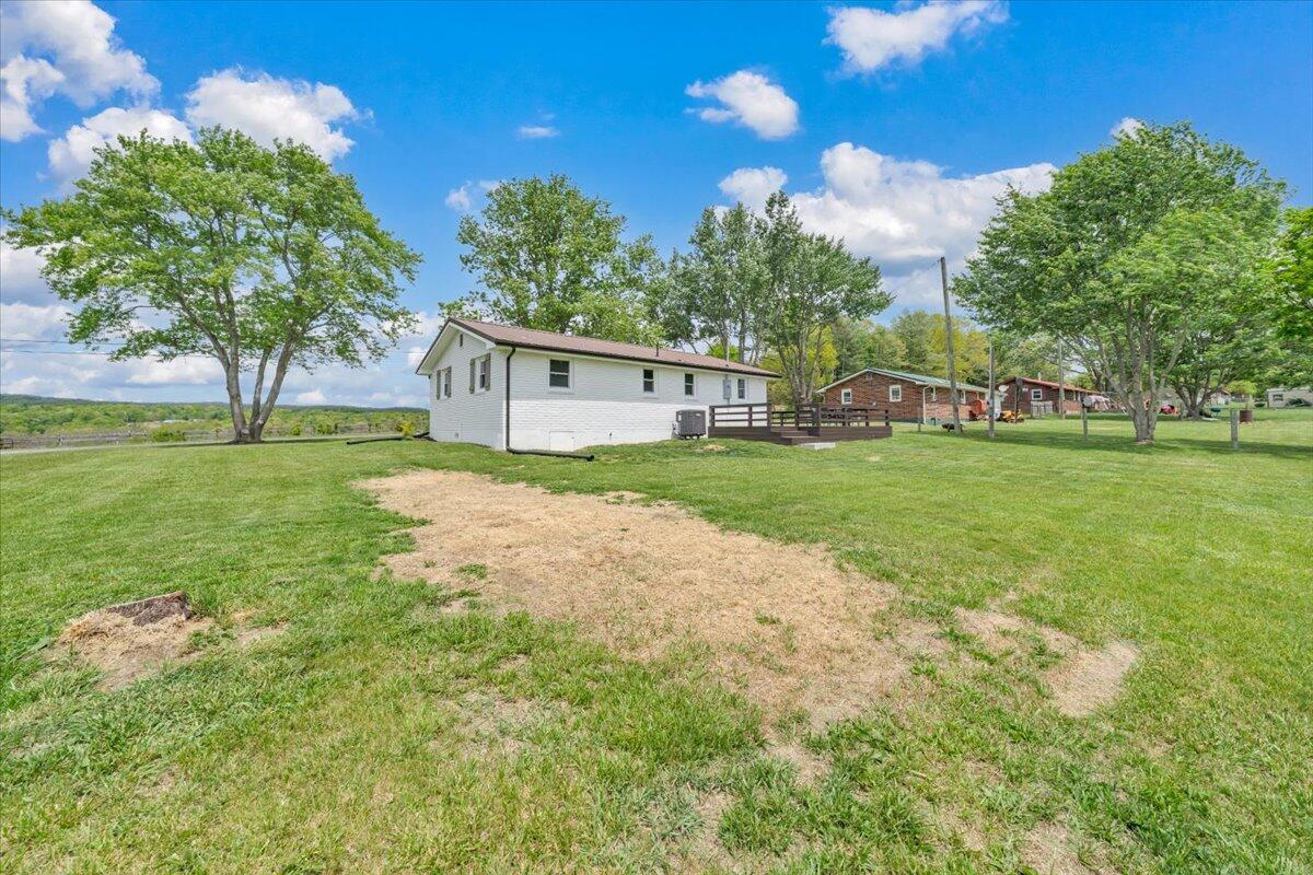 7153 Peppers Ferry Road Max Meadows, VA 24360 - Photo 36 of 67 a view of a house with a yard