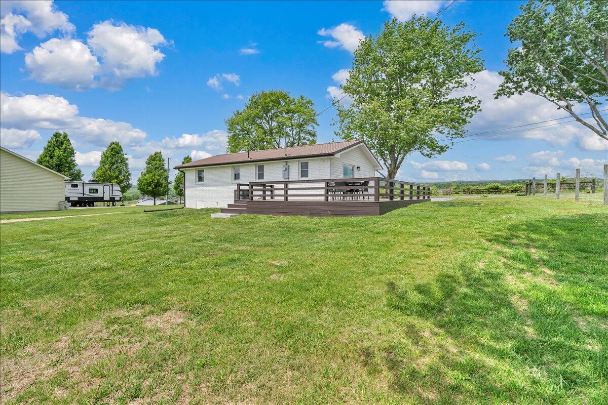 7153 Peppers Ferry Road Max Meadows, VA 24360 - Photo 38 of 67 a view of a house with a big yard and a large tree