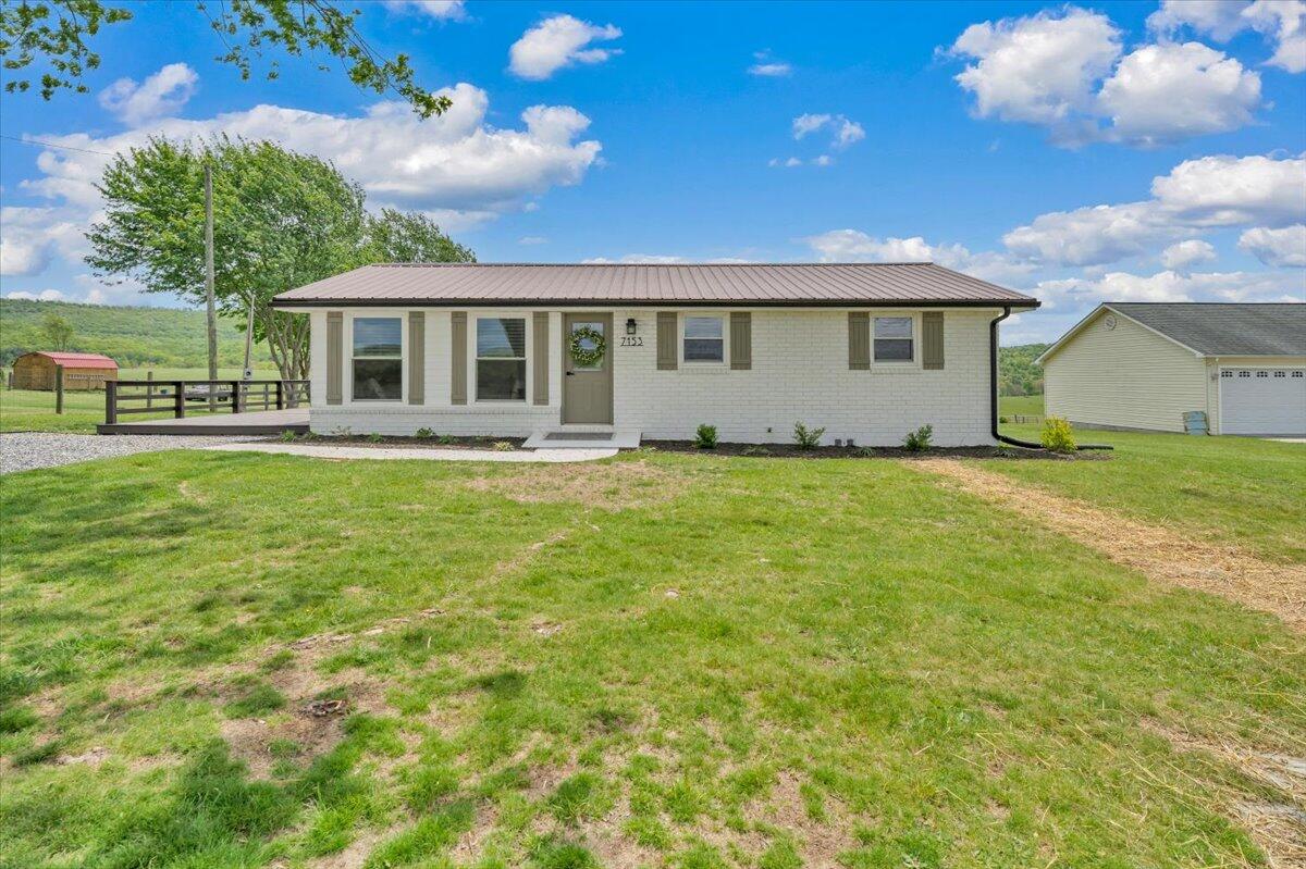 7153 Peppers Ferry Road Max Meadows, VA 24360 - Photo 40 of 67 a front view of a house with a garden