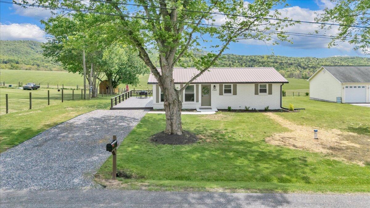 7153 Peppers Ferry Road Max Meadows, VA 24360 - Photo 62 of 67 a front view of a house with garden