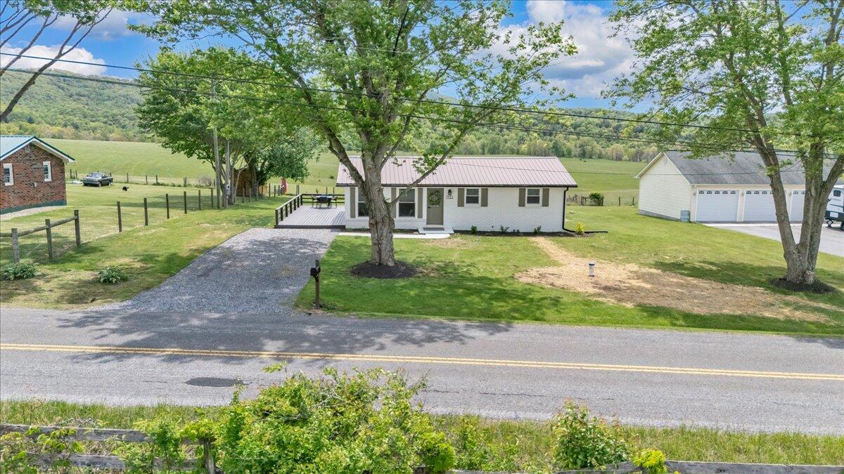 7153 Peppers Ferry Road Max Meadows, VA 24360 - Photo 63 of 67 a front view of a house with garden