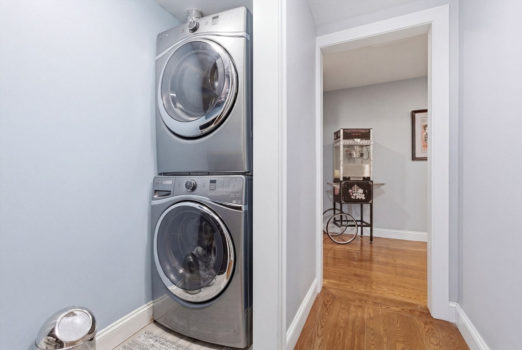 419 Main Street Boston, MA 02129 - Photo 32 of 41 a view of a storage and utility room with washer and dryer