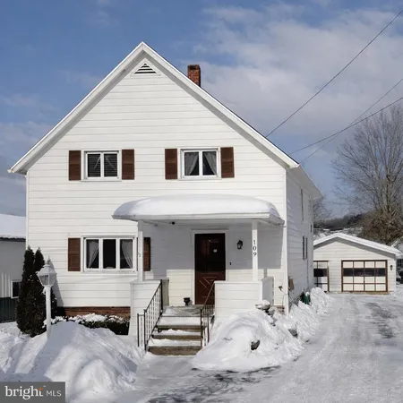a view of a white house with a large windows
