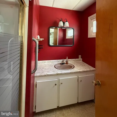 a bathroom with a sink and a mirror