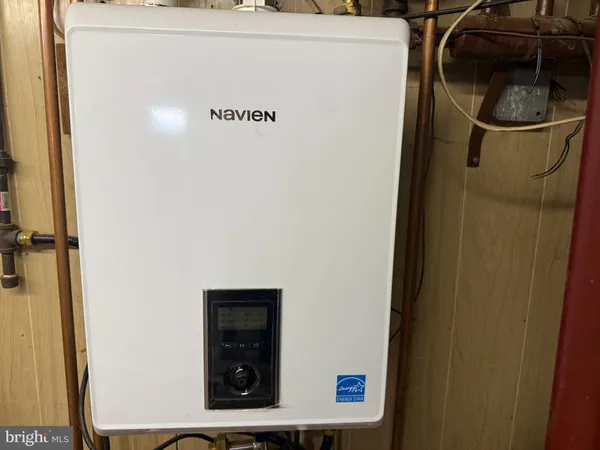 a close view of a utility room with dryer and washer