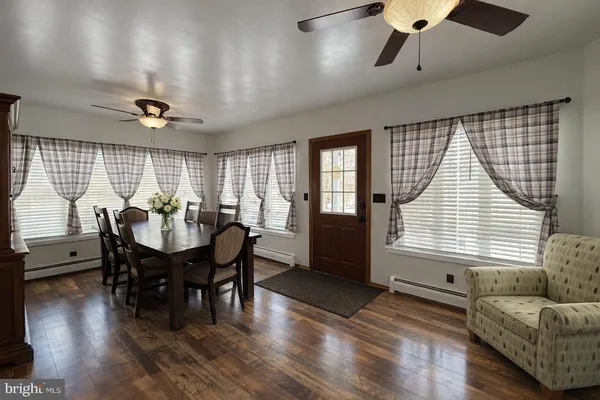 a workspace with furniture window and wooden floor