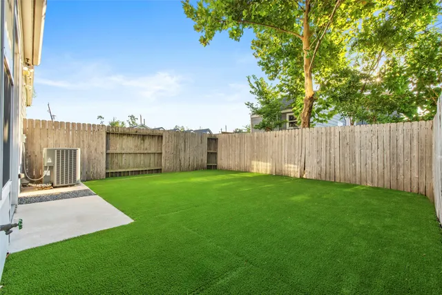 a view of a backyard with green space