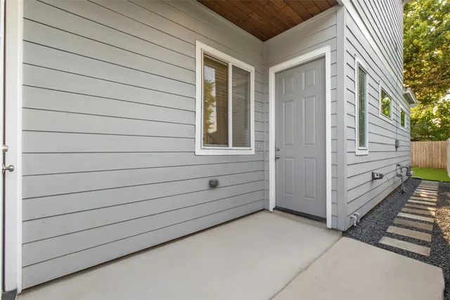 a view of a porch with wooden floor