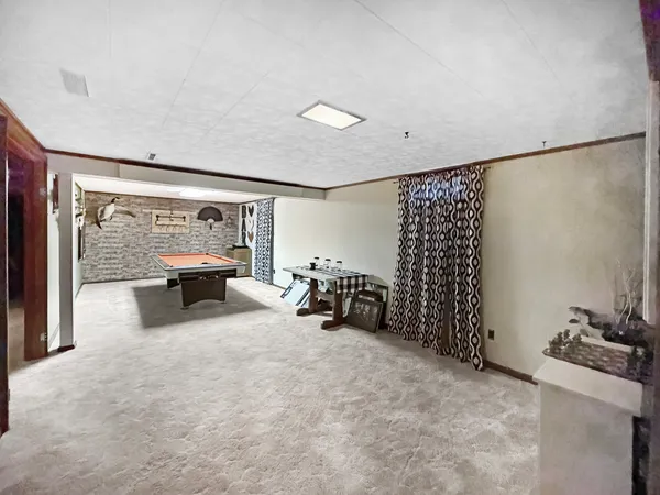 a bed room with furniture and a large window
