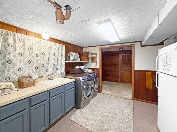 a view of a kitchen with storage and utility