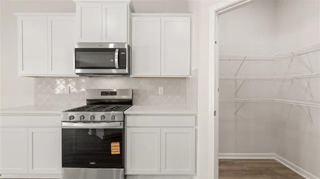 a view of kitchen with wooden floor