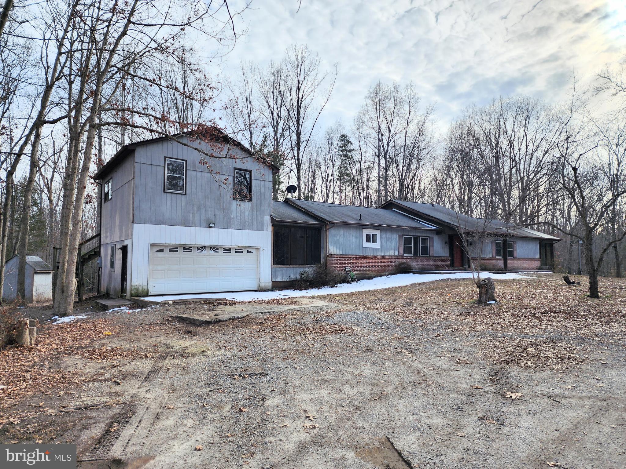 354 Carpenter Lane Mineral, VA 23117 - Photo 2 of 25 a front view of a house with a yard and garage