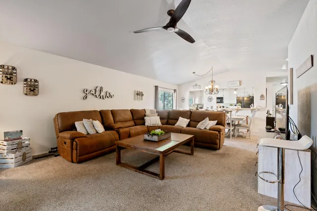a view of a dining room and livingroom with furniture