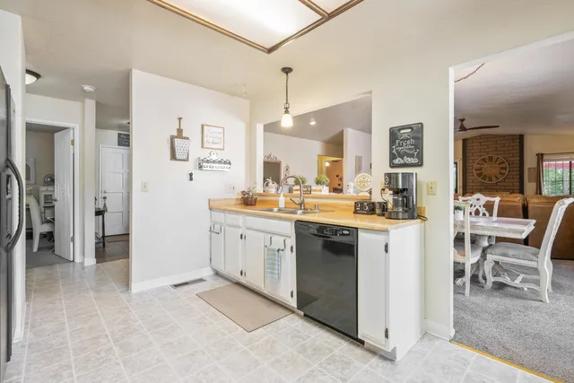 a kitchen with a sink and cabinets