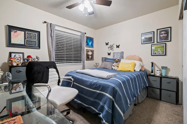 a bedroom with bed and a window