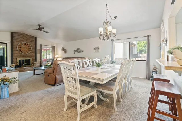 a living room with furniture fireplace and window