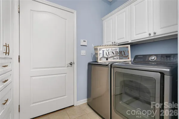 a utility room with washer and dryer