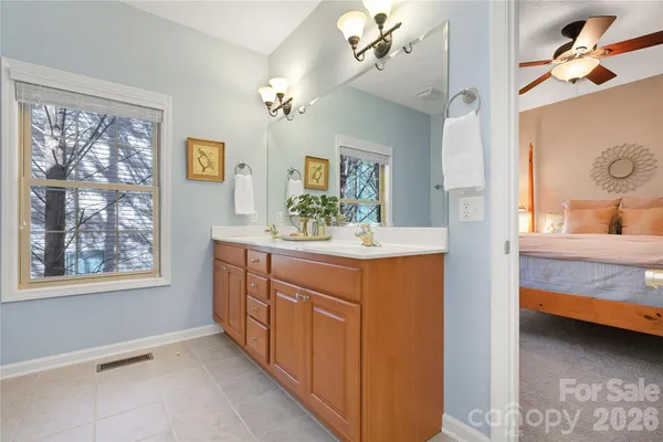 a bathroom with a sink double vanity and a mirror