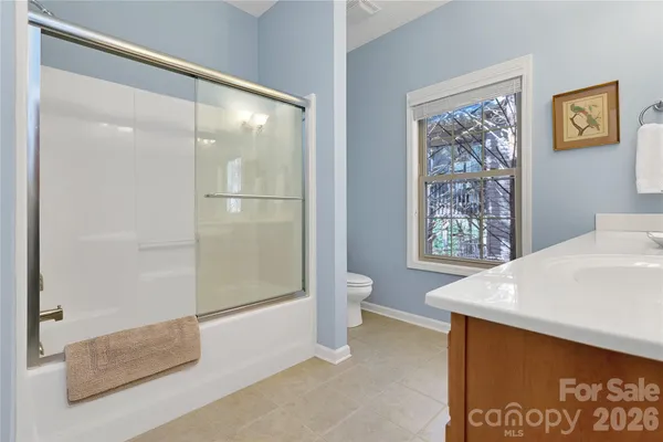 a bathroom with a bathtub and shower