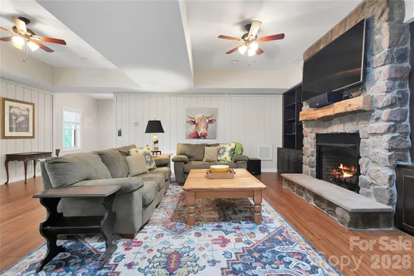 a living room with furniture and a fireplace