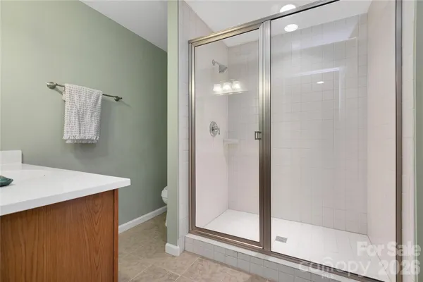 a bathroom with a double vanity sink and mirror