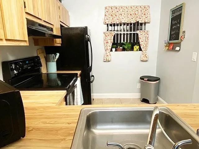 a bathroom with a bathtub and a sink