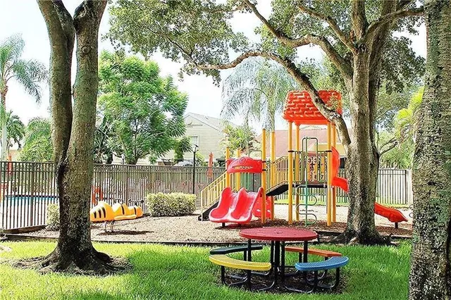 a view of a park with large trees