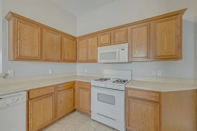a view with cabinets and washer