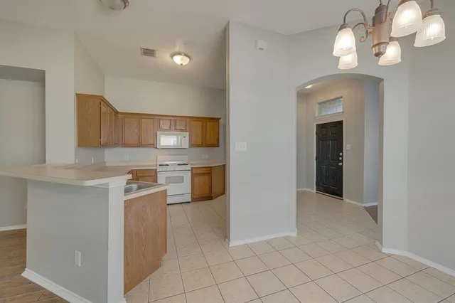 a view of a kitchen with a sink