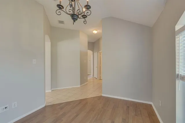 a view of a chandelier in big room