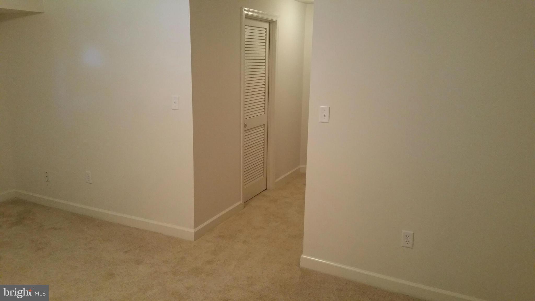 9237 Ridgefield Circle Frederick, MD 21701 - Photo 14 of 20 Basement hallway from fam rm new carpet