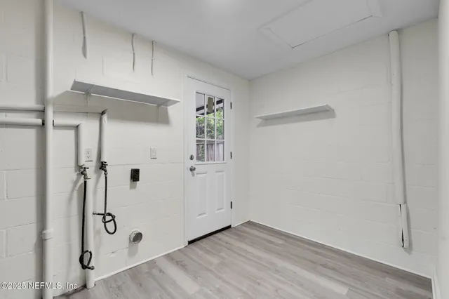 a view of a utility room with closet
