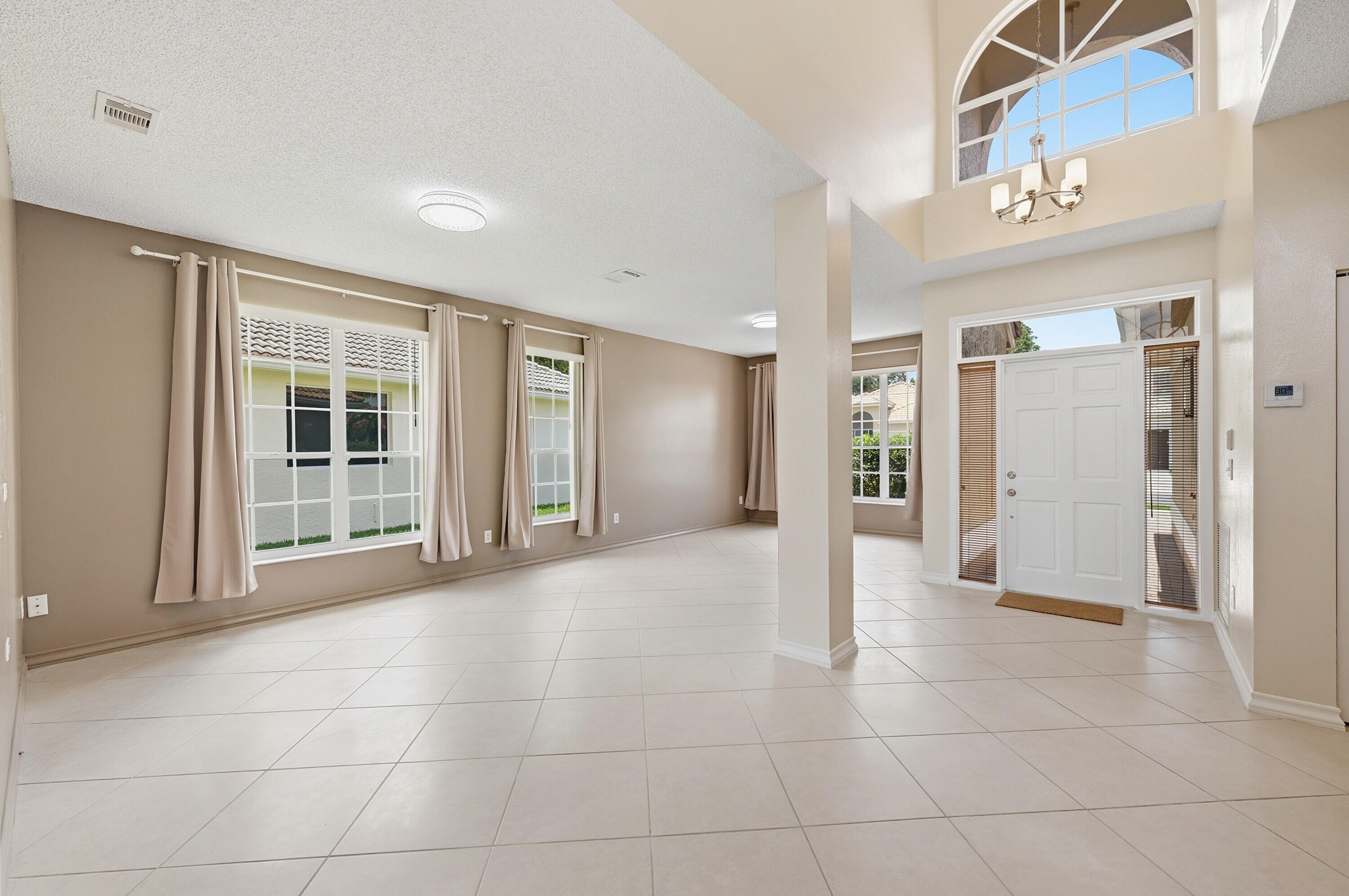 18474 Old Princeton Lane Boca Raton, FL 33498 - Photo 7 of 46 a view of an empty room with a window