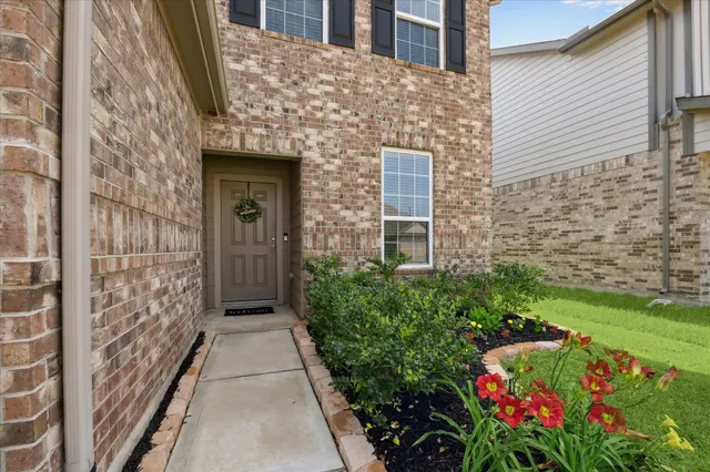 a view of a pathway with flower pots