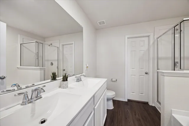 a bathroom with a sink and a large mirror
