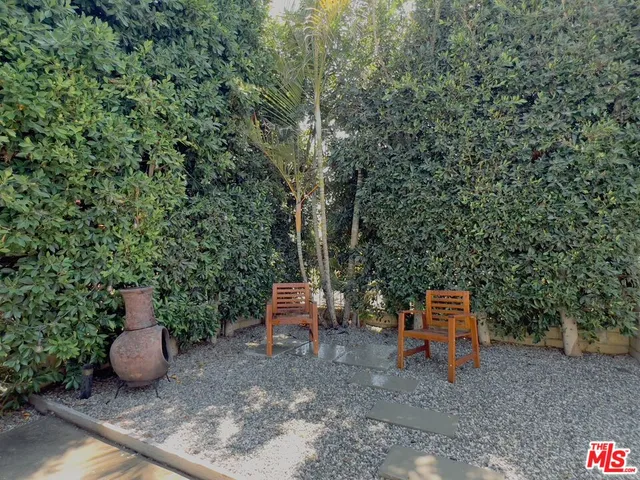 a view of a wooden floor and covered with trees